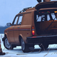 Illustration for article titled Simon Stålenhags futurescapes sport classic Euro cars, dinos, mechs